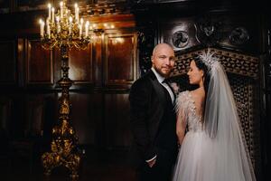 Elegant wedding couple in the interior of the old castle in the city of Nesvizh photo