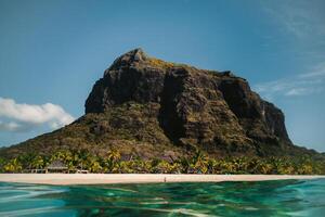 Beautiful beach, palm trees, and clouds on the horizon. Africa, Mauritius, South, near Le Morne photo