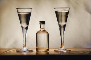 different alcohol bottles are on the table on a light background photo