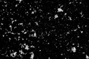 Snowfall on a black background. a design element. Snow background photo