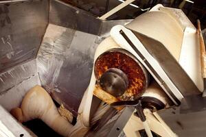 machine for making cookies in the factory. Conveyor belt with Cookie dough photo