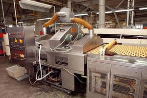 cookie making machine in the factory photo