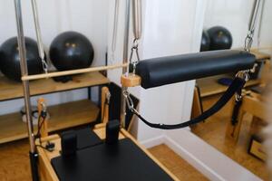 Trapeze table. Trapeze table - Pilates exercise machine photo