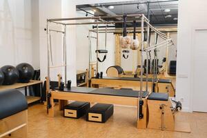 Trapeze table. Trapeze table - Pilates exercise machine photo