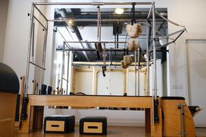 Trapeze table. Trapeze table - Pilates exercise machine photo