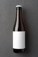 Beer bottle, on gray stone background, top view, with copy space for text photo