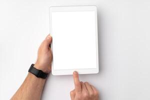 Digital tablet computer close up, man using tablet with hands photo