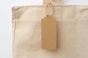 Eco bag for shopping with blank tag on white background photo