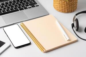 Minimalistic white workplace with keyboard and notebook photo