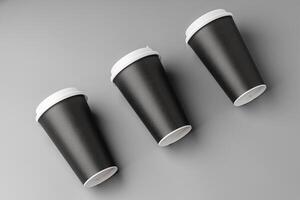 Black disposable cups arranged on a gray surface with white lids, creating a look suitable for a coffee shop setting photo