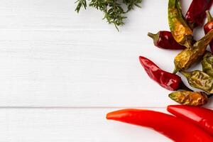 Flat lay composition with chili peppers and spices photo