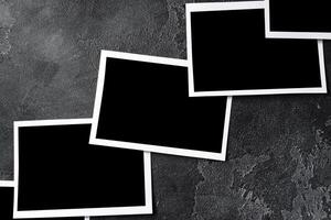 Paper photo frames with blank space on gray textured background