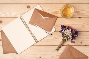 envelope and blank paper card with copy space mock up. photo