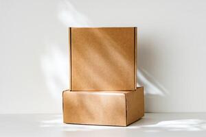 Freshly packed cardboard boxes resting on a white surface, illuminated by soft natural light photo