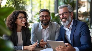 Three professionals smiling and collaborating in a modern workspace during a bright afternoon meeting photo