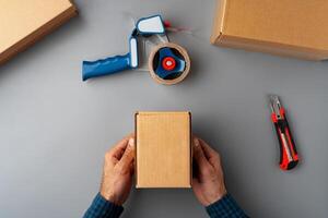 Above table top view of warehouse preparing post courier delivery package photo