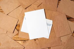 Stack of envelopes on working desk top view. Business mail photo