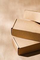 Stacked cardboard boxes on a neutral background in a shipping or packaging setting photo