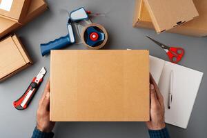 Above table top view of warehouse preparing post courier delivery package photo