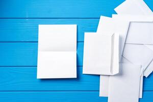 Stack of envelopes on working desk top view. Business mail photo