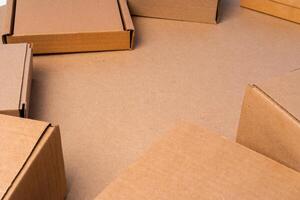 Cardboard box on beige background in studio photo