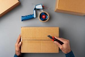 Above table top view of warehouse preparing post courier delivery package photo