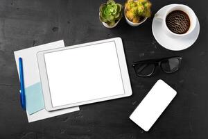 Minimal workplace with digital tablet and supplies photo