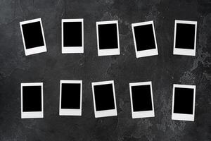 Paper photo frames with blank space on gray textured background