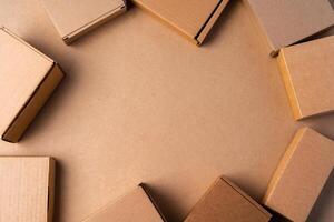 Cardboard box on beige background in studio photo