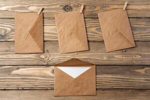 Stack of envelopes on working desk top view. Business mail photo
