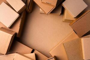 Cardboard box on beige background in studio photo