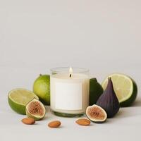 A scented candle with fresh figs, limes, and almonds arranged on a neutral backdrop for a calming atmosphere photo