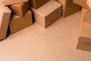 Cardboard box on beige background in studio photo