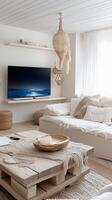 Bright and airy living room featuring a cozy seating area with a minimalist design and a large television displaying a scenic view photo