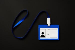 Badge on string on black background top view photo