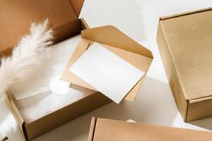 Delivery package with a blank envelope and decorative elements on a light background photo