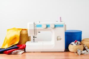 A sewing machine with colorful threads and fabric in a bright crafting space for creative projects photo