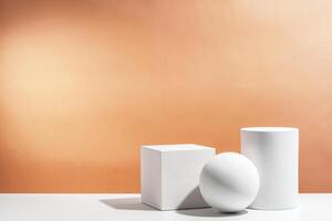 White geometric shapes arranged stylishly on a soft peach background in a minimalist setting photo