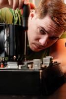 Man assembles a computer system unit at home photo