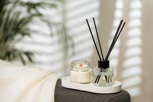 Aroma diffuser bottle with sticks in living room photo