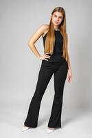 Woman With Long Hair in Black Pants and Top photo