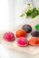 Multi-colored Japanese cakes Mochi in a white plate photo