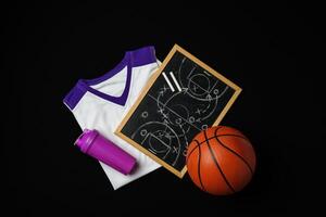 Basketball Strategy Planning With Chalkboard, Ball, and Jersey on Dark Background photo