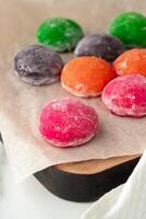 Multi-colored Japanese cakes Mochi in a white plate photo