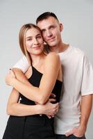 A Man and a Woman Standing Next to Each Other in studio photo