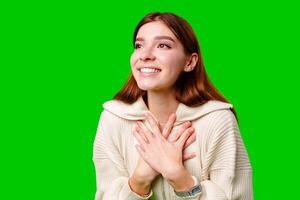A woman wearing a skirt and sweater is striking a pose for a picture, standing confidently in front of the camera. photo
