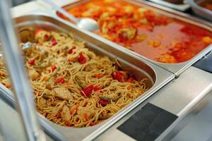 Assorted Dishes Served at a Catered Buffet During a Midday Event photo