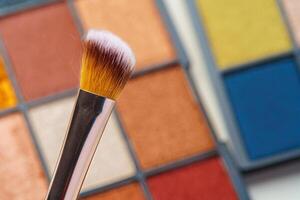 Make-up palette and brushes. Professional eyeshadow palette. photo