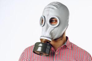 Portrait of a man in a gas mask. Panic during quarantine. Coronavirus pandemia photo