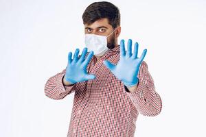 Stop world pandemia of coronavirus. Portrait of a man wearing protective mask photo